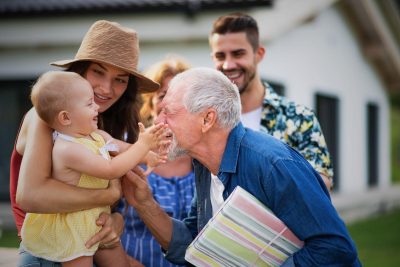 ARK Homes Heritage Pointe Multi generational family greeting outdoors