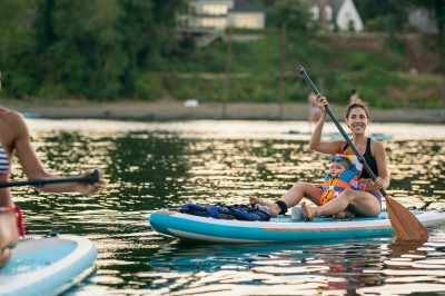 ARK Homes Heritage Pointe Woman Kayaking on Calm Water